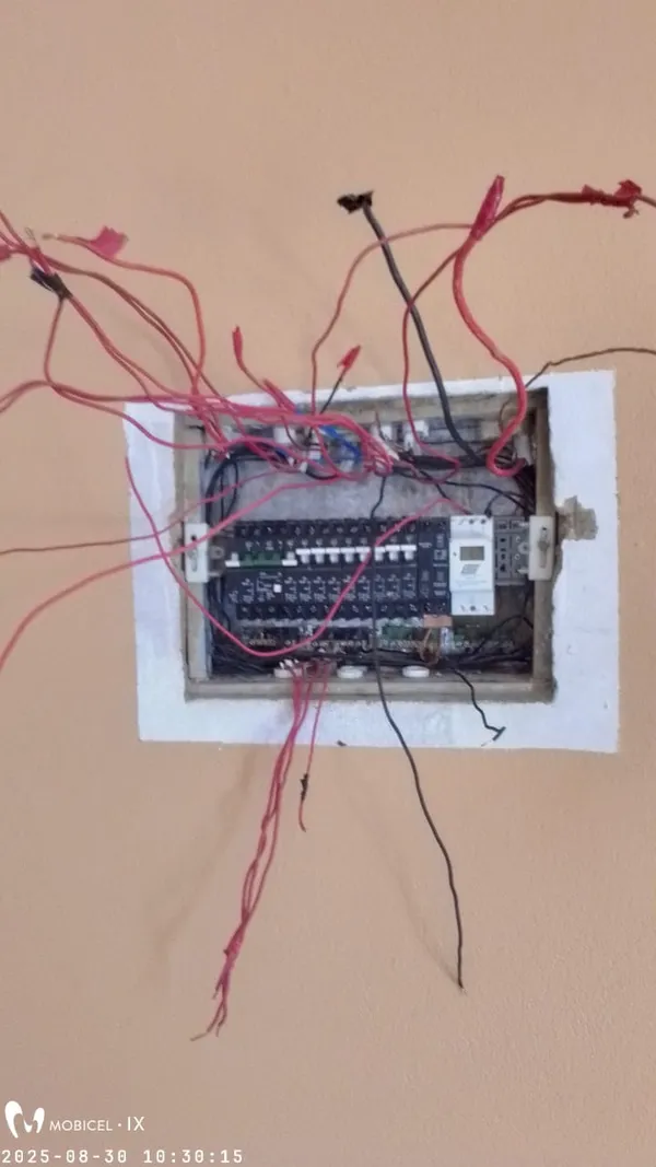 Open distribution board showing circuit breaker layout