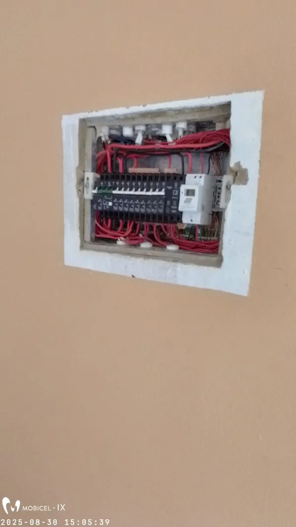 Electrician working on a distribution board installation